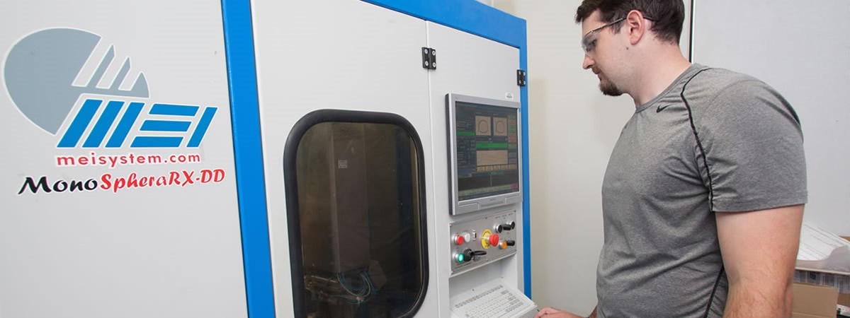 picture of lab tech at  machine